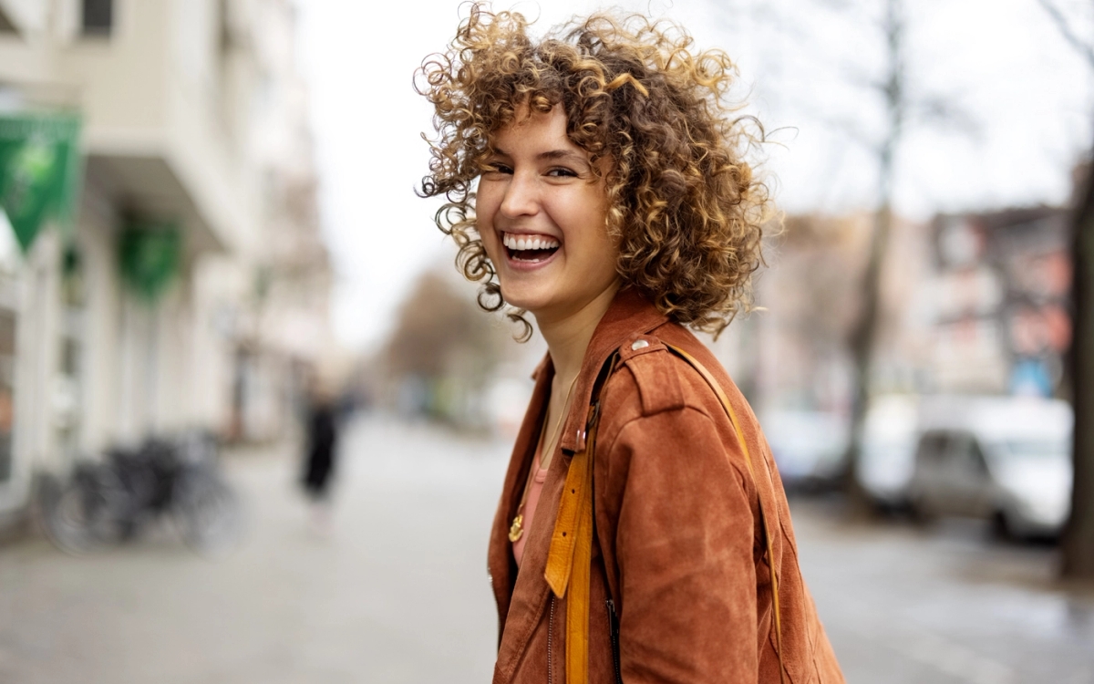 happy_women_with_curly_hair_merseh.webp